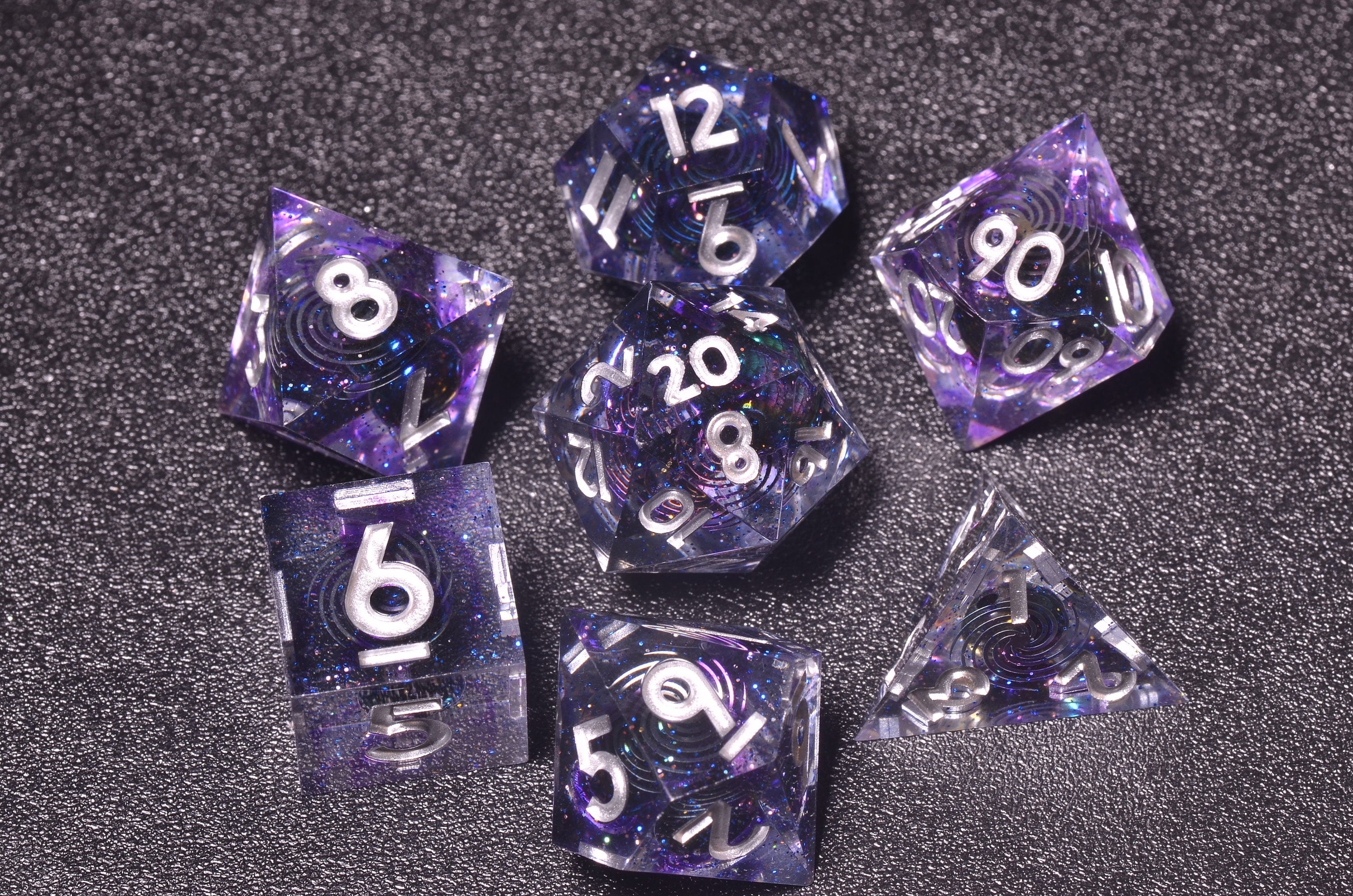 A complete D&D dice set for new players must include all seven polyhedral dice (d4, d6, d8, d10, d%, d12, d20)
