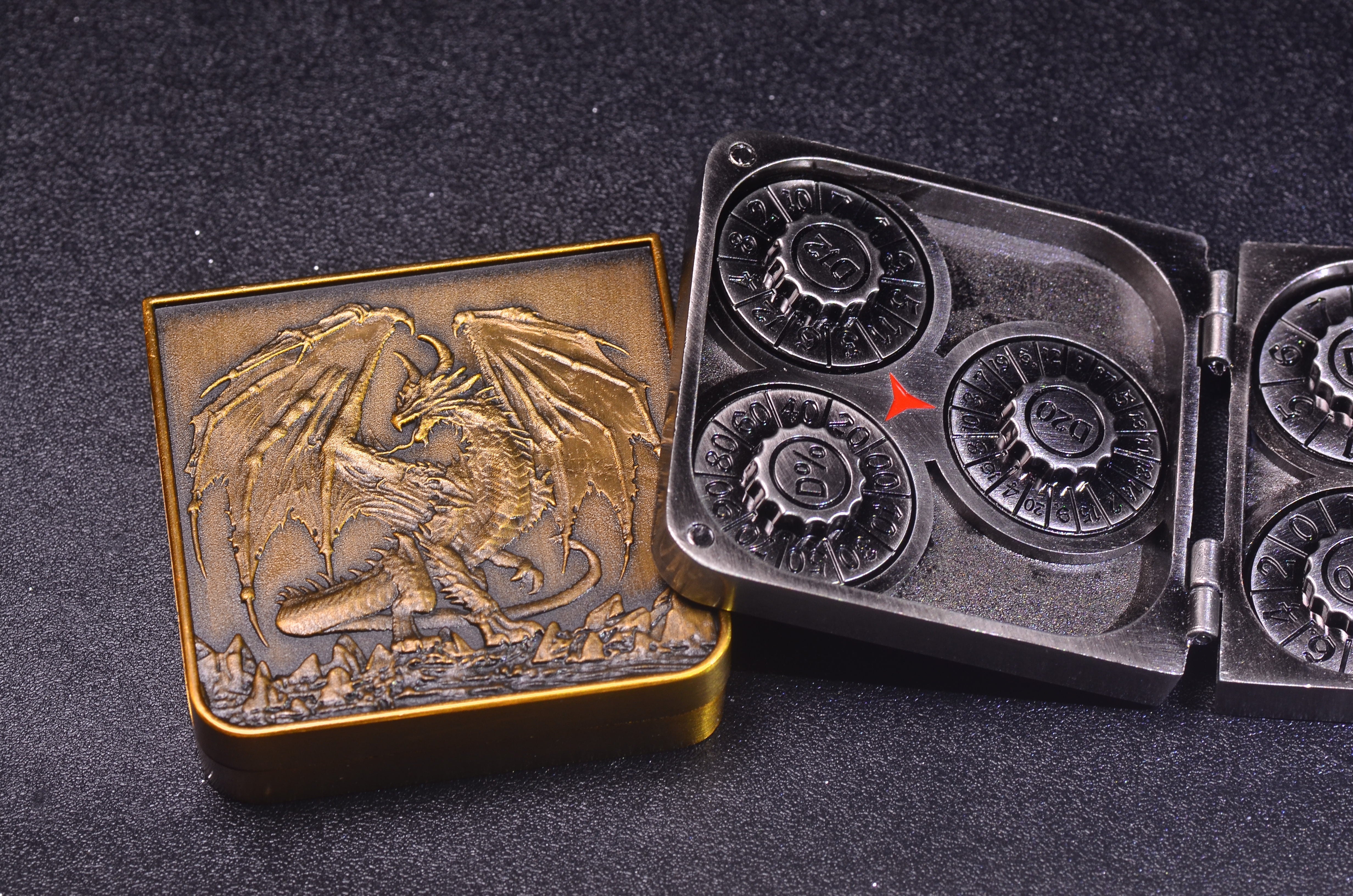 Compact folding metal dice case in a portable pocket-sized design for traveling DMs.