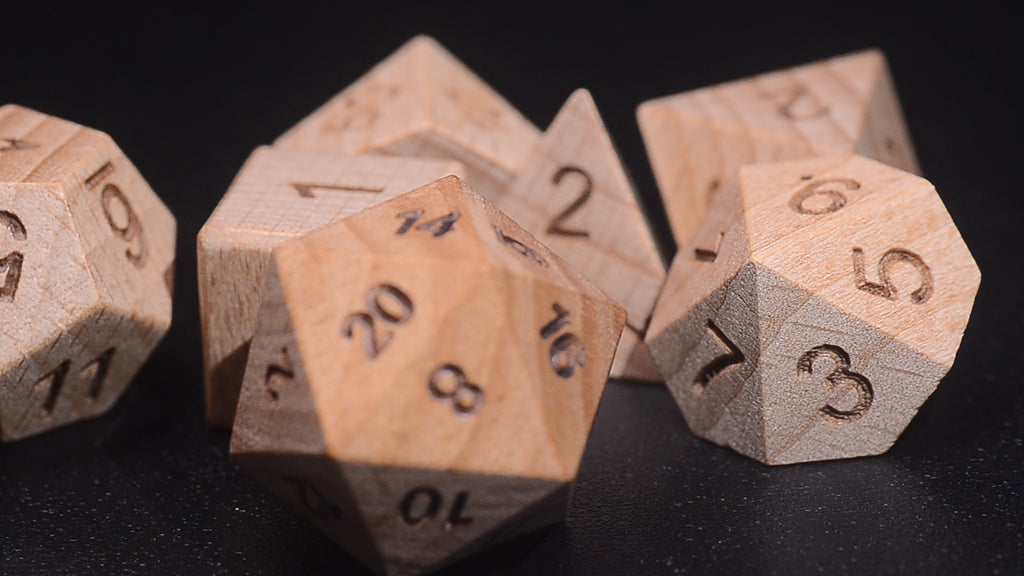 Rolling handcrafted wooden DND dice on a leather tray for Dungeons and Dragons druid character